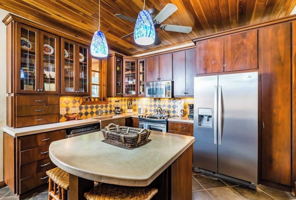 Cook in style in the fully equipped modern kitchen of this Tamarindo villa. Perfect for vacation rentals, it features high-end appliances, ample counter space for a luxurious Costa Rica getaway.