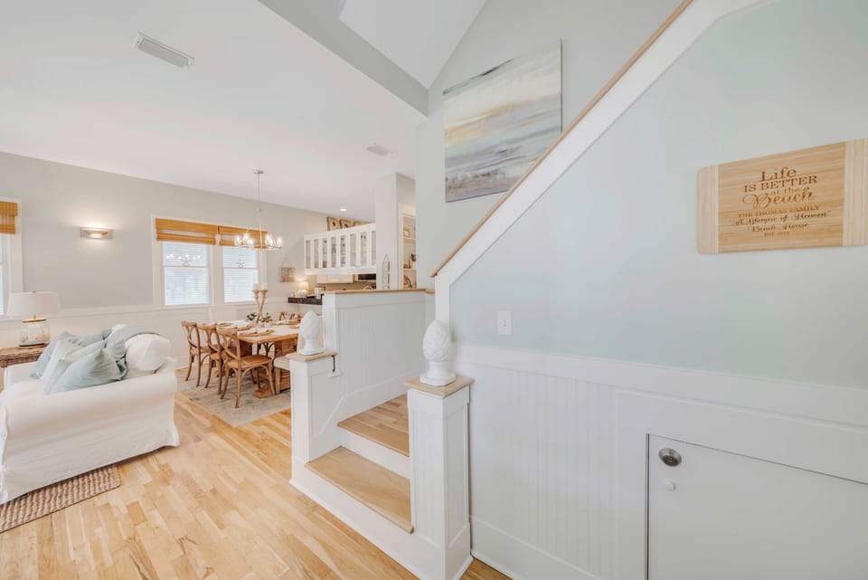 Foyer to open living and dining areas with stairs to 2nd and 3rd floors