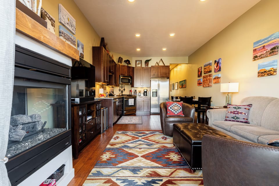 Spacious living room connected to kitchen and dining area.