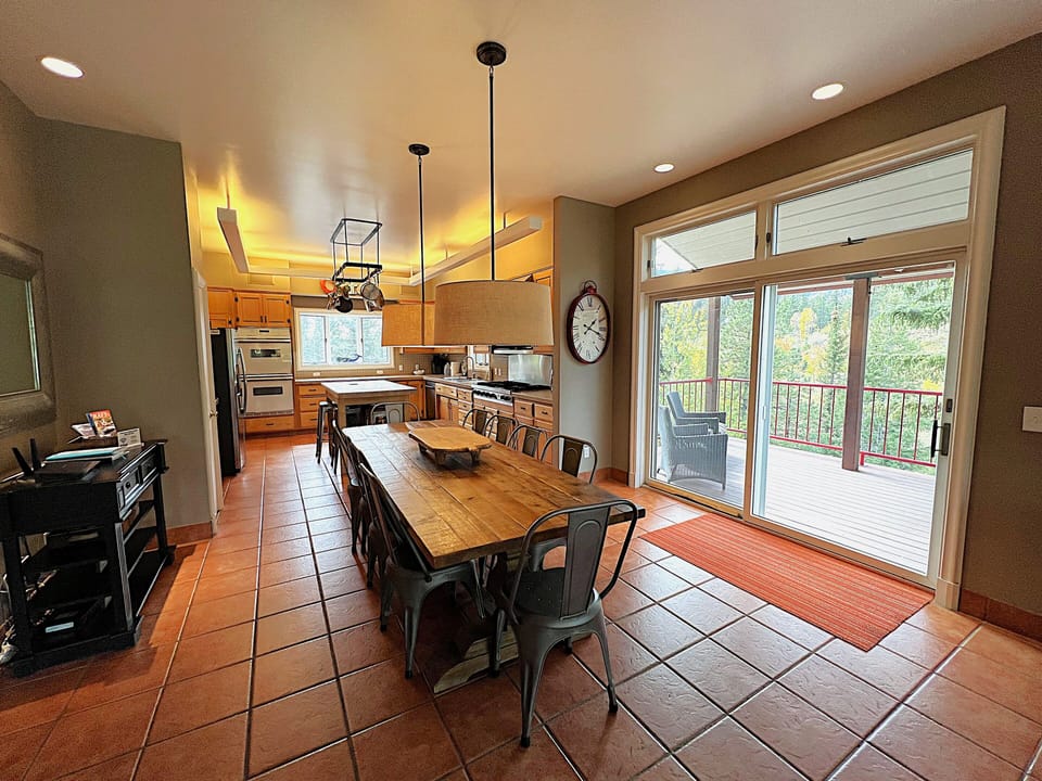 Fully Stocked Kitchen and Dining Area