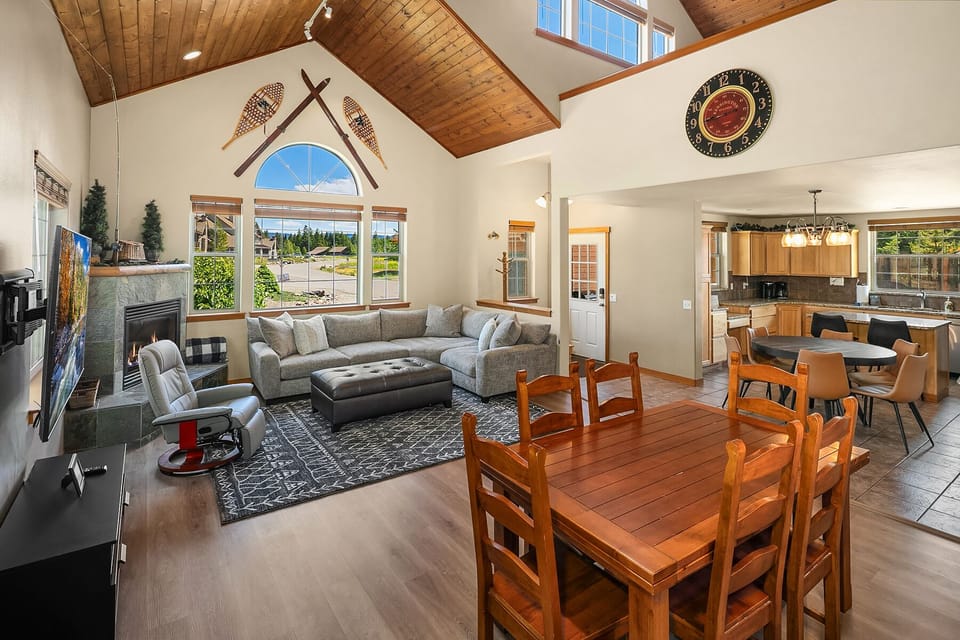 Evergreen Lodge. - Great room with a large comfortable sectional couch and extra dining table.