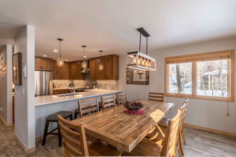 Seating for eight at the dining room table and four additional seats at the breakfast bar