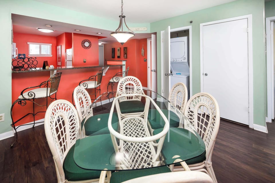 Dining area with seating for six and washer and dryer