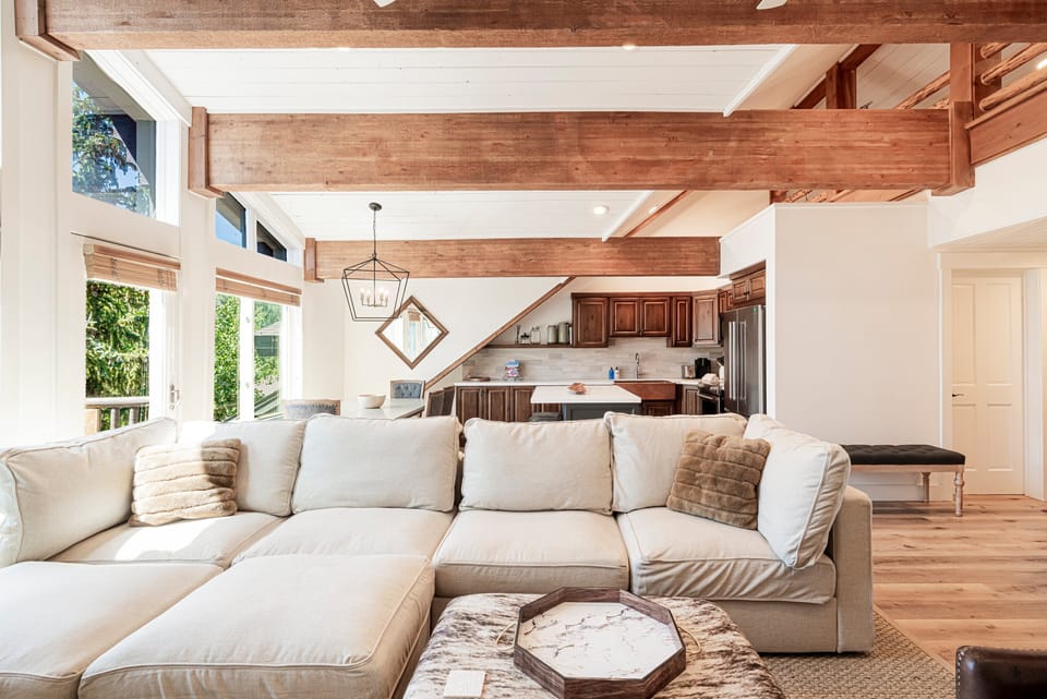 Penthouse A living room with 70" smart TV, fireplace and updated sofa and furnishings