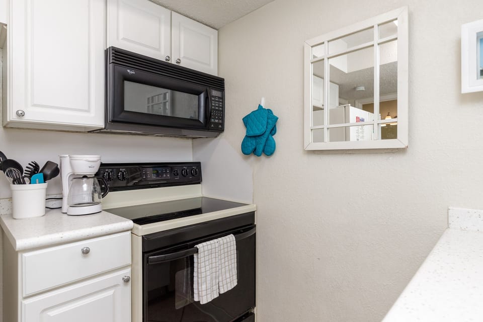 Your fully equipped kitchen features modern appliances and ample counter space for preparing delicious home-cooked meals during your stay.