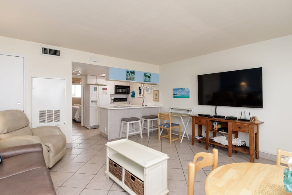 Relax in your bright, open-concept space where the kitchen flows seamlessly into the living area, perfect for cooking and unwinding together.