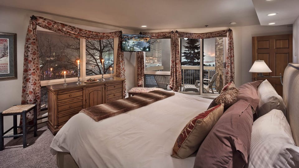 Bedroom 1, Main Level - Primary king suite with private balcony and views.