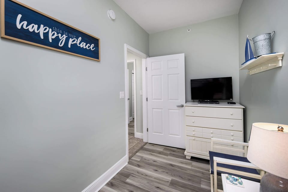 Third bedroom with bunk beds and TV