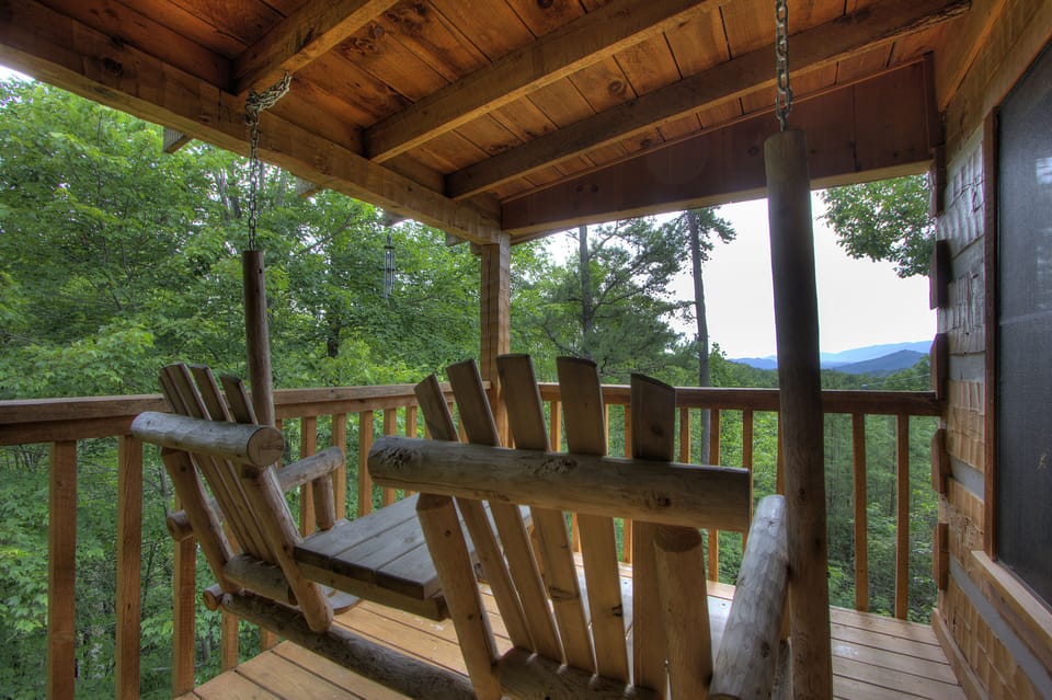 Romantic Escape - Relax on your back porch swing and enjoy the stunning view.
