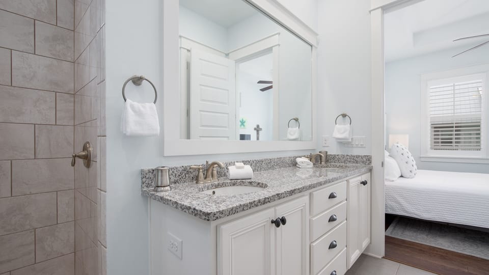 Bathroom with Double Sinks and Step in Shower