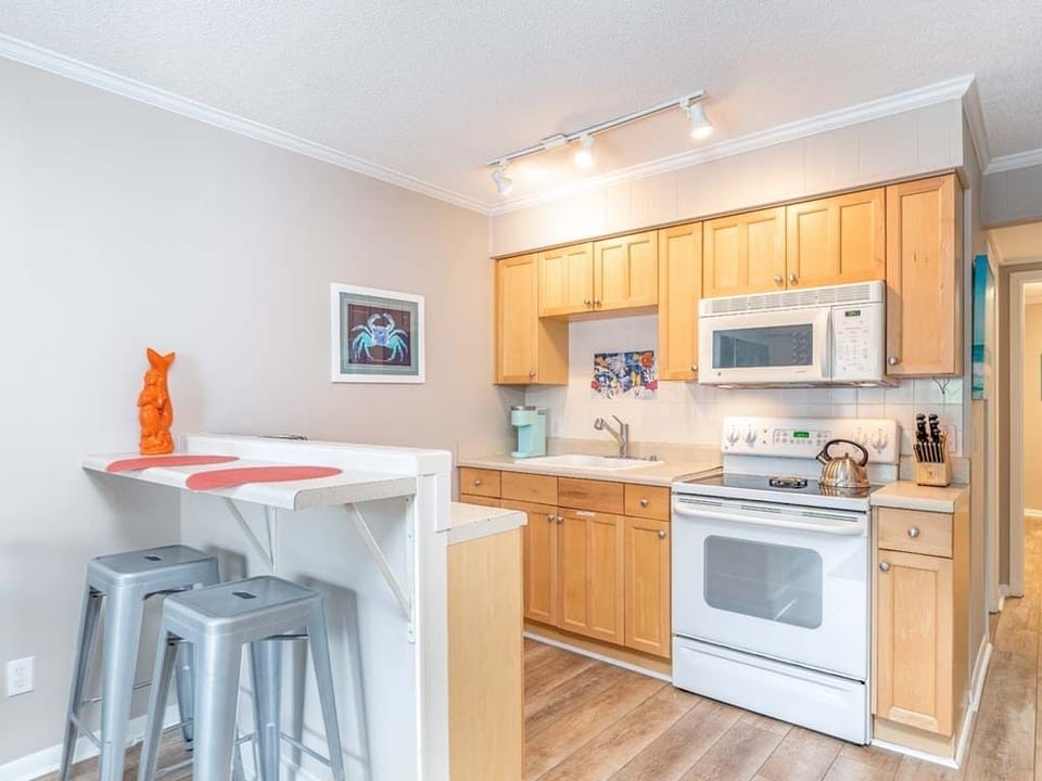 Kitchen area with counter seating for 2