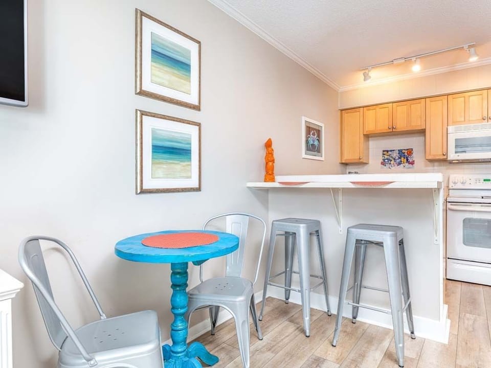 Kitchen area with counter seating for 2