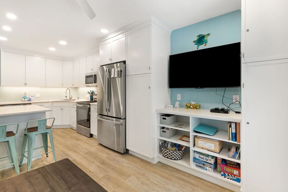 Living Room with Flat Screen TV and Private Balcony
