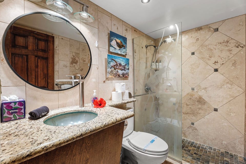Tiled bathroom with walk-in shower