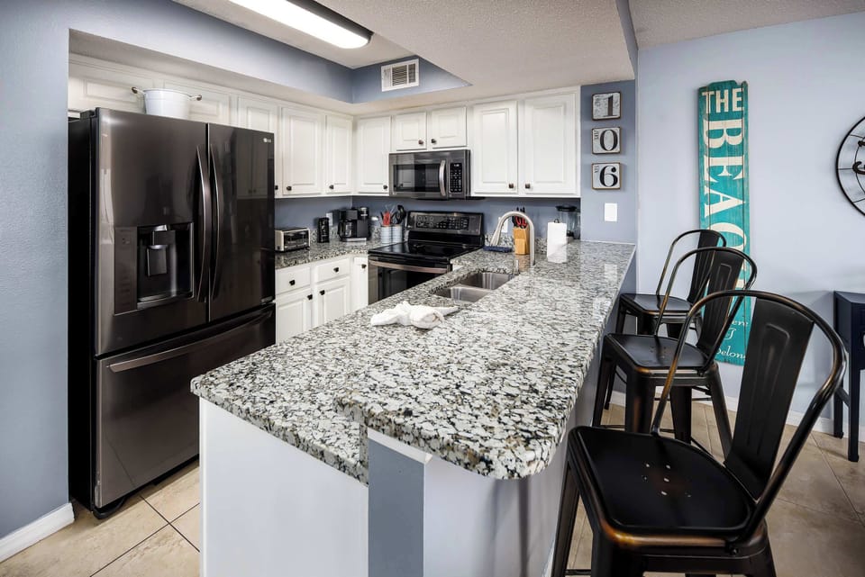 Fully stocked kitchen with breakfast bar