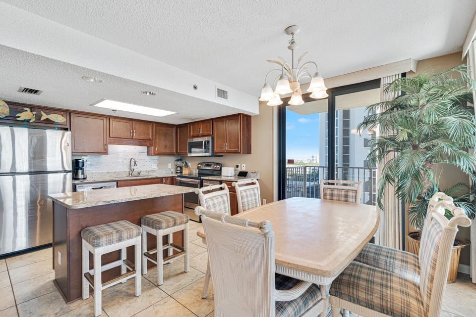 Spacious Living Area with plenty of comfortable seating and direct balcony access so you can enjoy views of the gulf from almost everywhere!