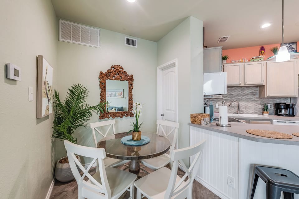 Gather around your stylish dining nook with cozy seating for four, perfectly positioned next to your fully-equipped kitchen for effortless meal prep.