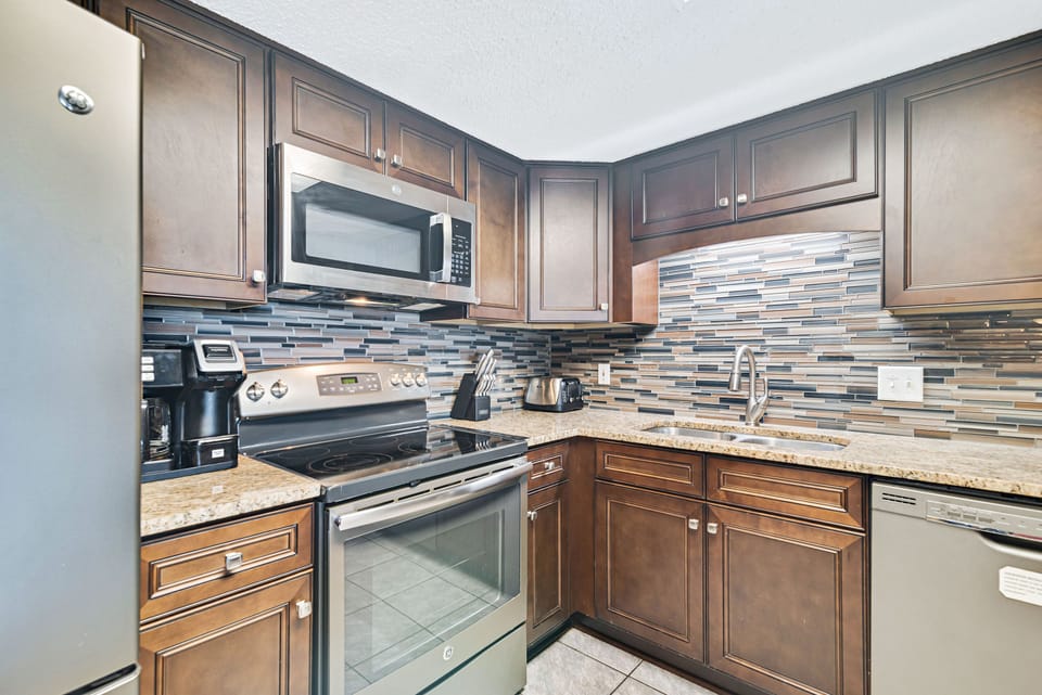 Fully Equipped Kitchen, recently upgraded with Stainless Steel Appliances, Custom Cabinets and Granite Counter Tops.