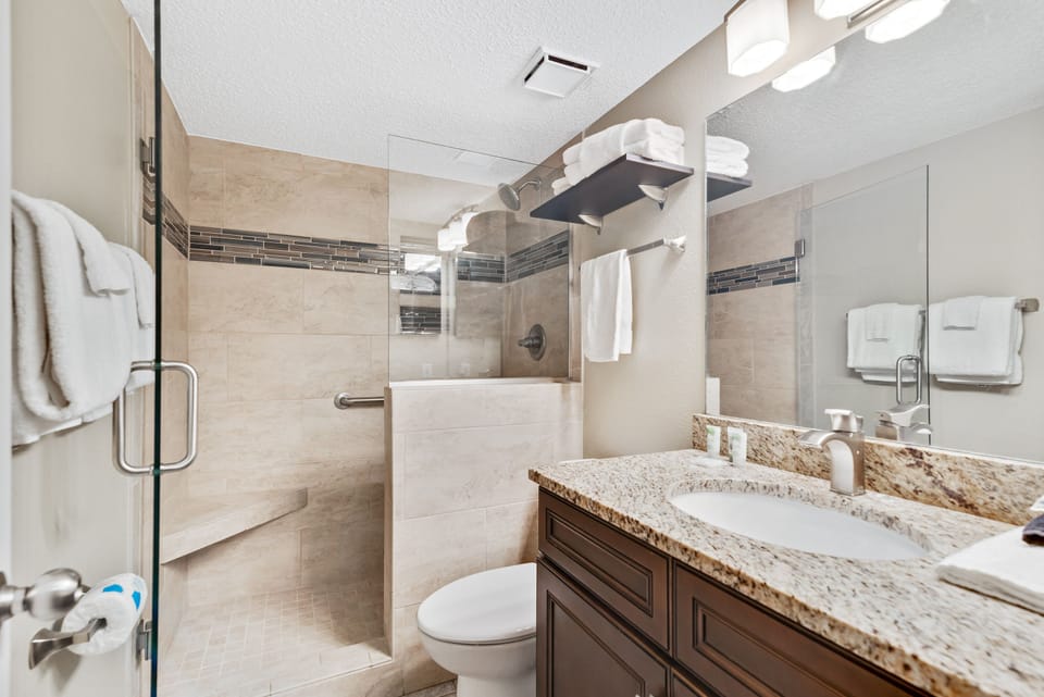 Private Guest Bath with Granite Counter Top and beautifully Tiled Shower.