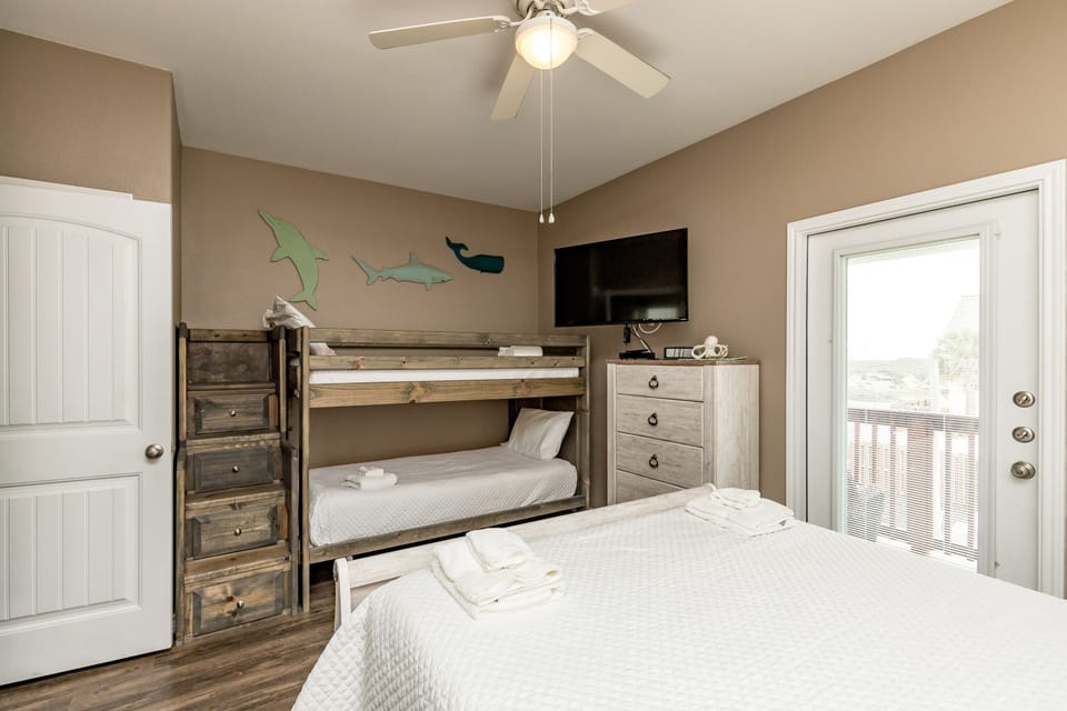 Your kids will love the charming bunk bed and marine-themed decor, while you relax knowing everyone sleeps comfortably in this thoughtfully designed room.