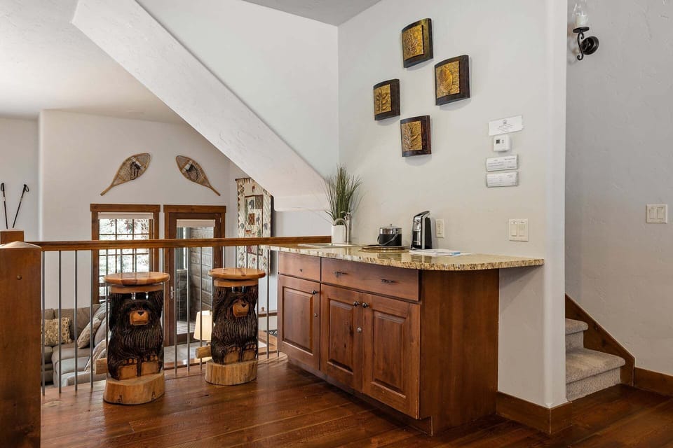 Wet bar on the kitchen level above the living room