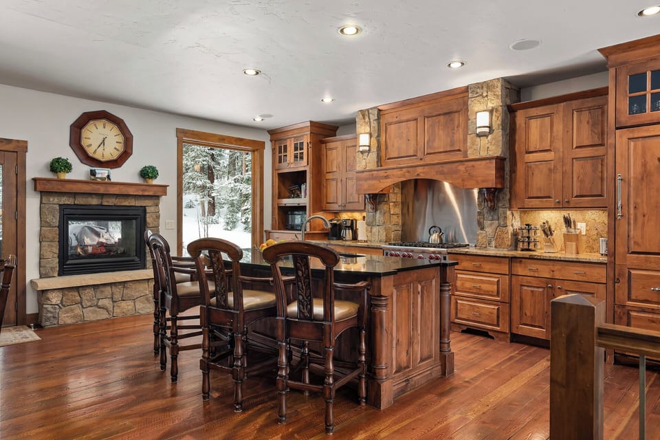 Seating for three at the breakfast bar and access to back deck/hot tub/grill