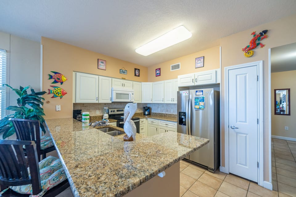 Beautiful remodeled kitchen has stainless appliances.