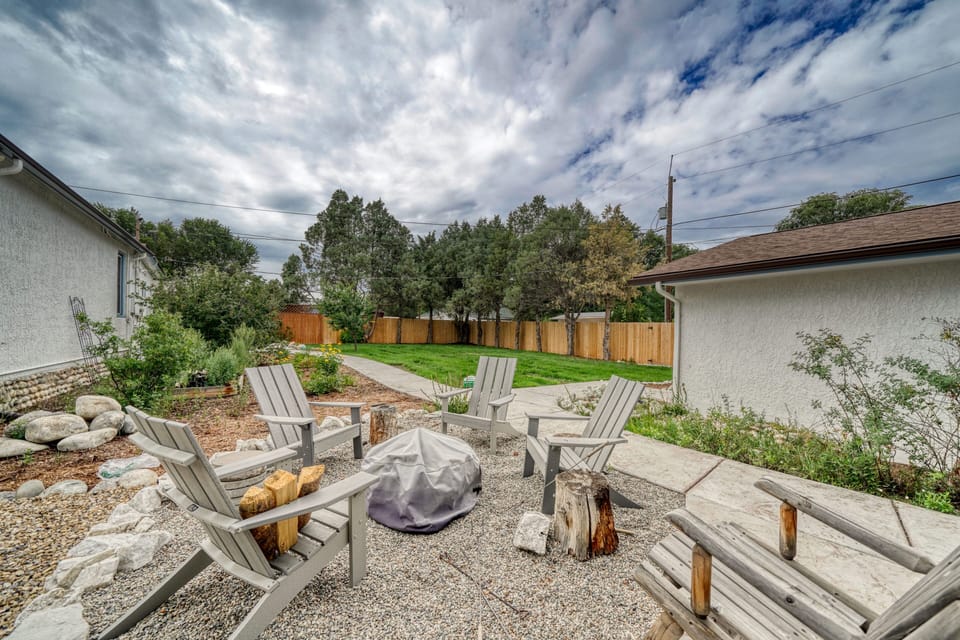 Private backyard with firepit, outdoor dining area and propane BBQ grill
