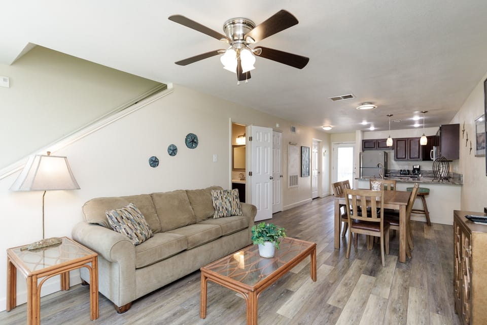 Relax in your spacious open-concept living space with comfortable seating and sleeper sofa