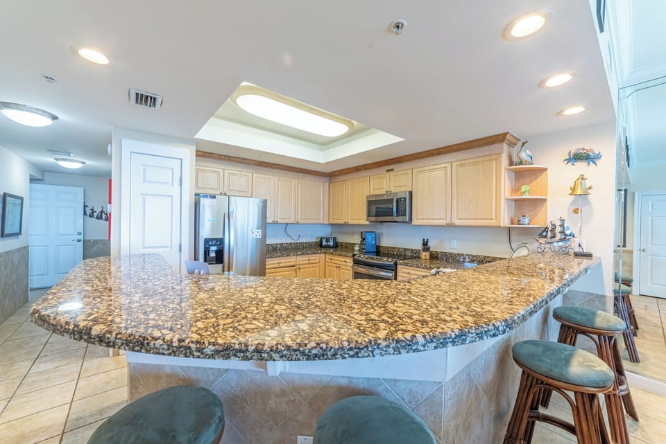 Huge kitchen with modern appliances & plenty of storage plus granite counter tops. Full sized laundry, too.