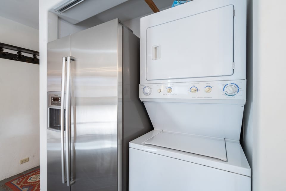 Refrigerator and Laundry Center in the Kitchen.