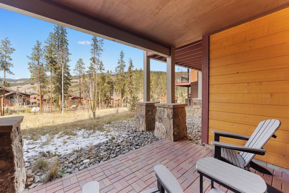 Step onto your covered patio and breathe in the crisp mountain air while relaxing in comfortable Adirondack chairs.