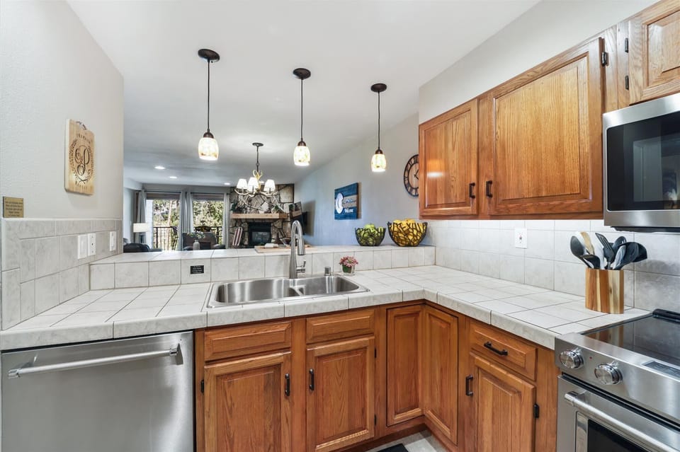 Kitchen overlooking the dining and living areas - Atrium 108 Breckenridge Vacation Rental