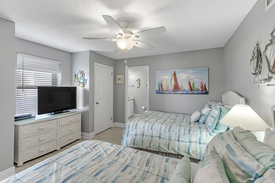 Guest Room has 2 Full Size Beds and a Private Guest Bath.
