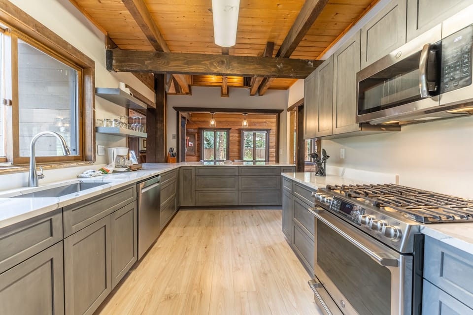 Updated full size kitchen with granite countertops, hardwood flooring and new stainless steel appliances throughout.