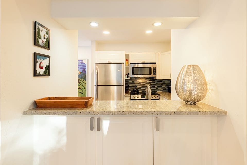 Kitchen with Open Wall into Living Area
