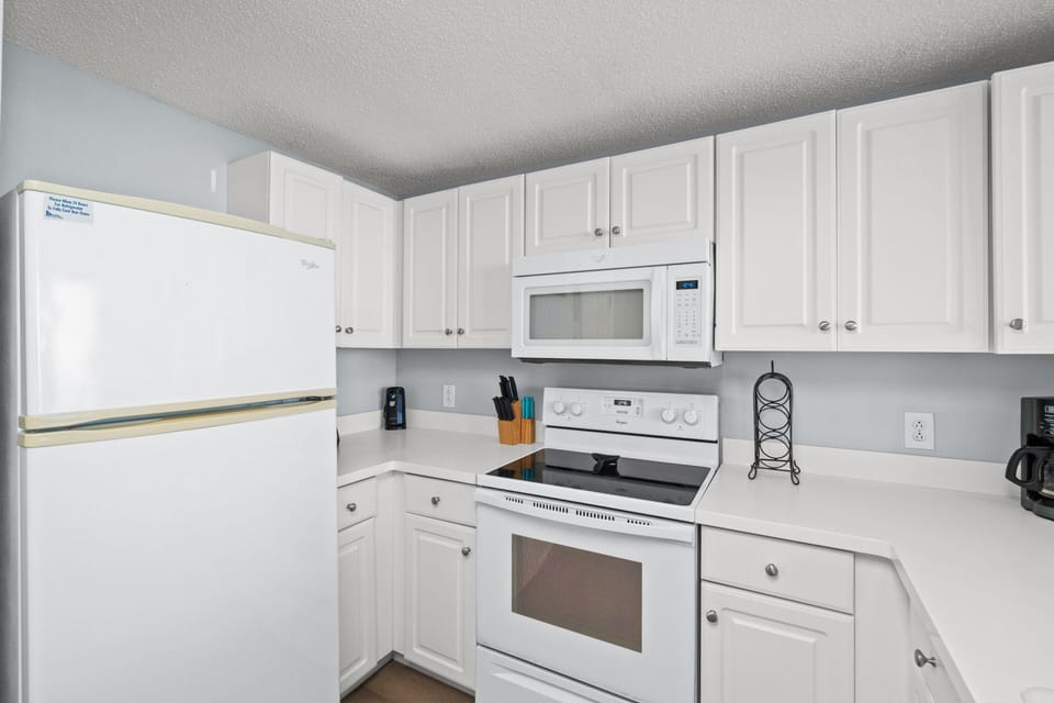 Fully Stocked Kitchen with Bar Seating