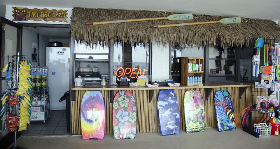 The poolside Tiki Hut sells quick snacks and drinks as well as everything you need for the BEACH!