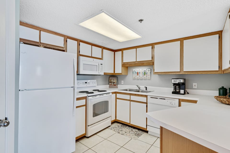 Full Size Kitchen with Stainless Steel Appliances and Breakfast Bar