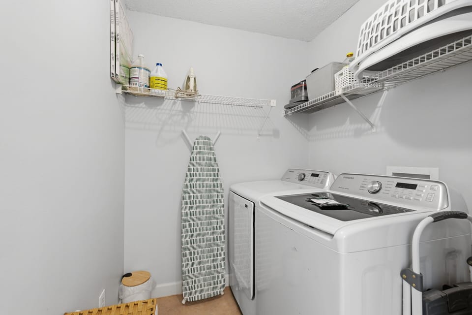 Huge Laundry Room With Full Sized Washer and Dryer