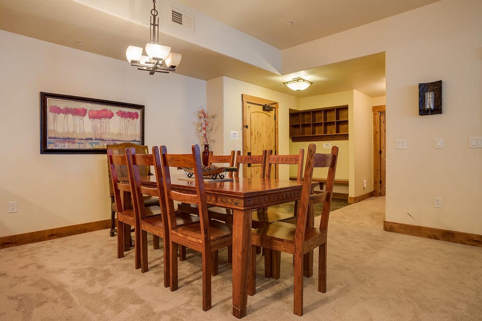 Gather around your beautiful wooden dining table for memorable meals and conversations in this warm, spacious dining area.