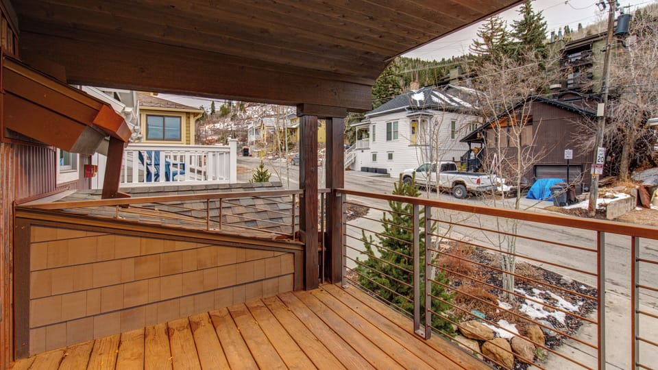 Enjoy the mountain air from your private deck, featuring modern cable railing and charming neighborhood views. Perfect for morning coffee or evening relaxation in Park City.