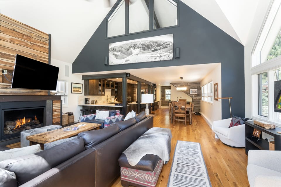 Plenty of lounging space in the living room to enjoy a movie or the cozy fireplace.
