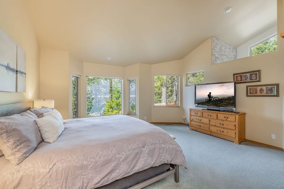 Bedroom 1 master with en suite located on the main floor with a king sized bed