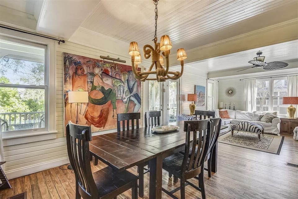 Main level dining area with view of living room - This gorgeous main level dining area flows right into the living room and kitchen, giving everyone plenty of room to gather, laugh, and enjoy time together.