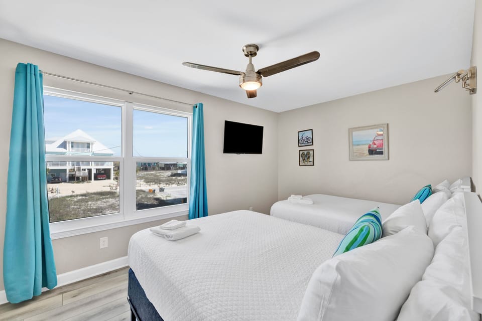 Bedroom 3 has a TV and two Full beds - sleeps 4