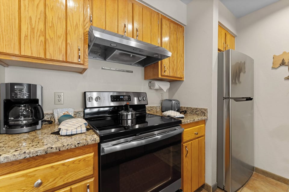 Your fully equipped kitchen features granite counters, stainless appliances, and a coffee maker for perfect mornings.