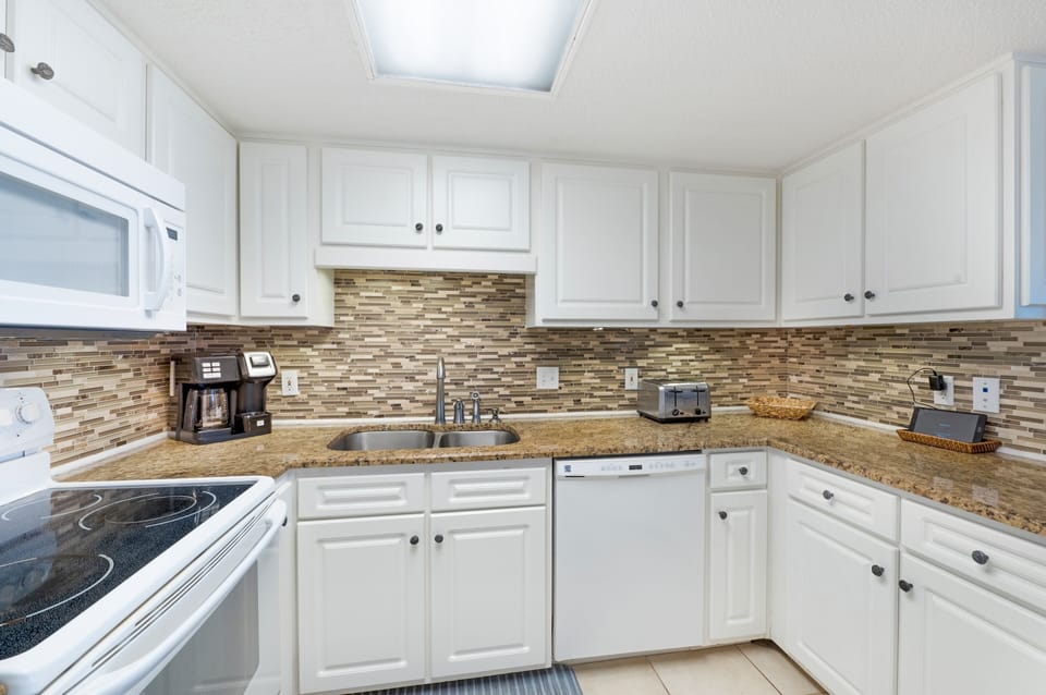 Full Size Kitchen has Upgraded Cabinets and Granite Counter Tops with a Breakfast Bar