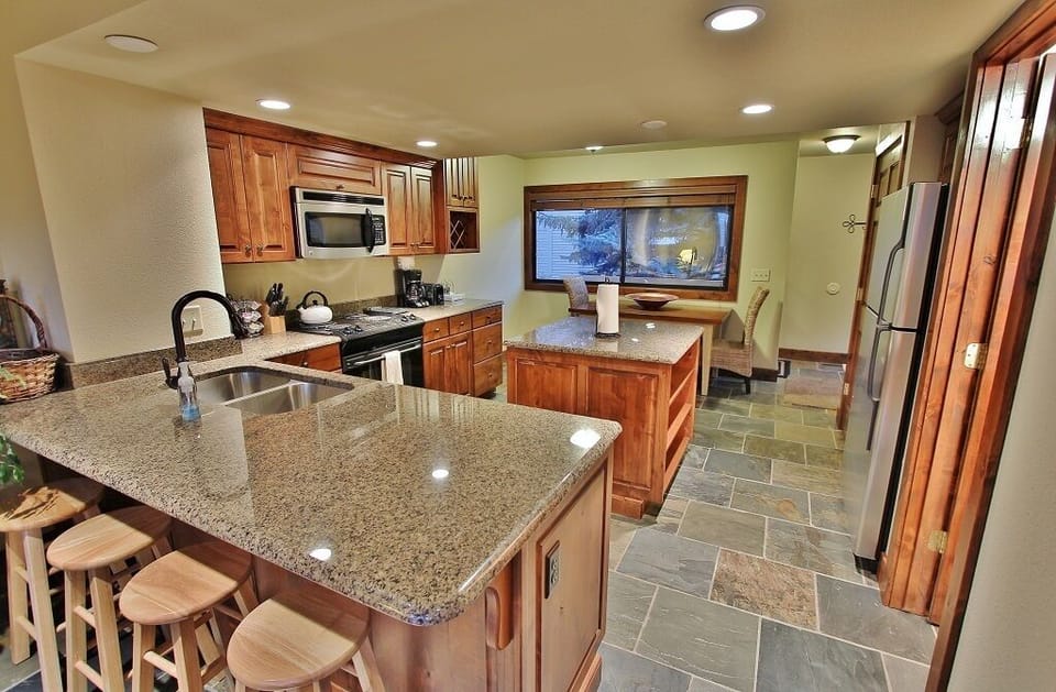 Kitchen with stainless steel appliances and granite counter tops in Park City Racquet Club Village - Park City