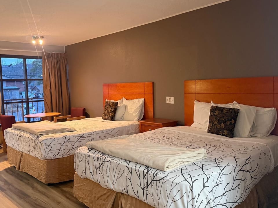 Standard Room, 2 Queen Beds | Desk, laptop workspace, WiFi (free), individually decorated